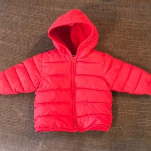 Red puffer coat